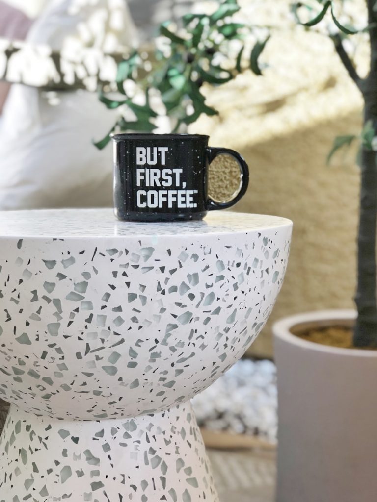 black ceramic mug on white round table
